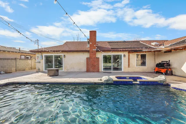 a front view of house with yard and barbeque oven