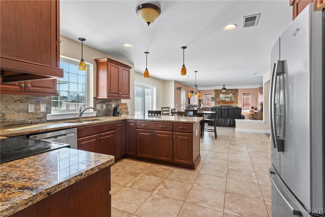 127 Fox Ridge Nazareth, PA 18064 - Photo 11 of 48 a kitchen with a sink a counter top space appliances and cabinets