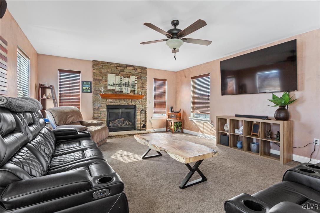 127 Fox Ridge Nazareth, PA 18064 - Photo 13 of 48 a living room with furniture a fireplace and a flat screen tv