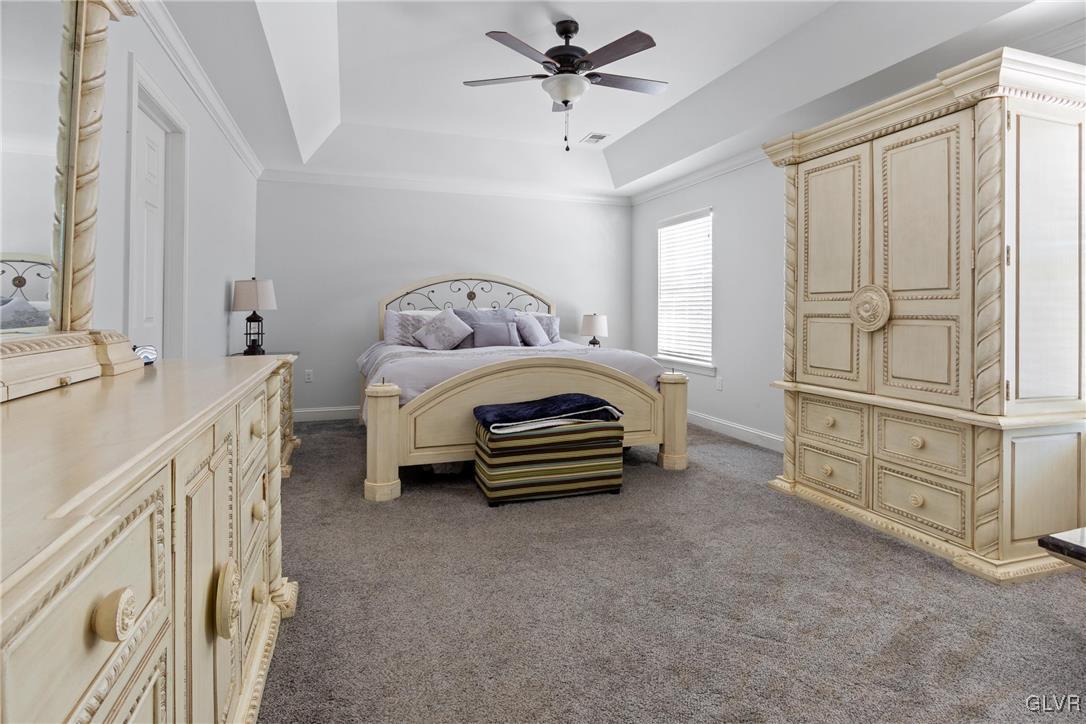127 Fox Ridge Nazareth, PA 18064 - Photo 18 of 48 a bedroom with furniture and a chandelier