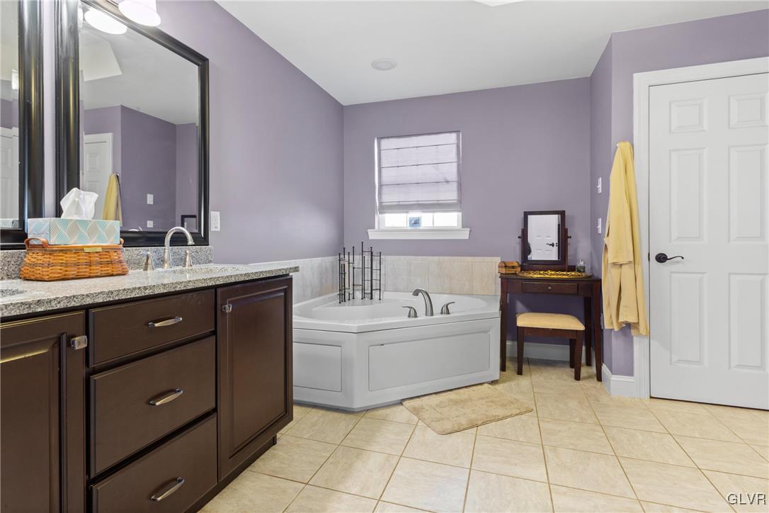 127 Fox Ridge Nazareth, PA 18064 - Photo 20 of 48 a bathroom with a tub sink and mirror