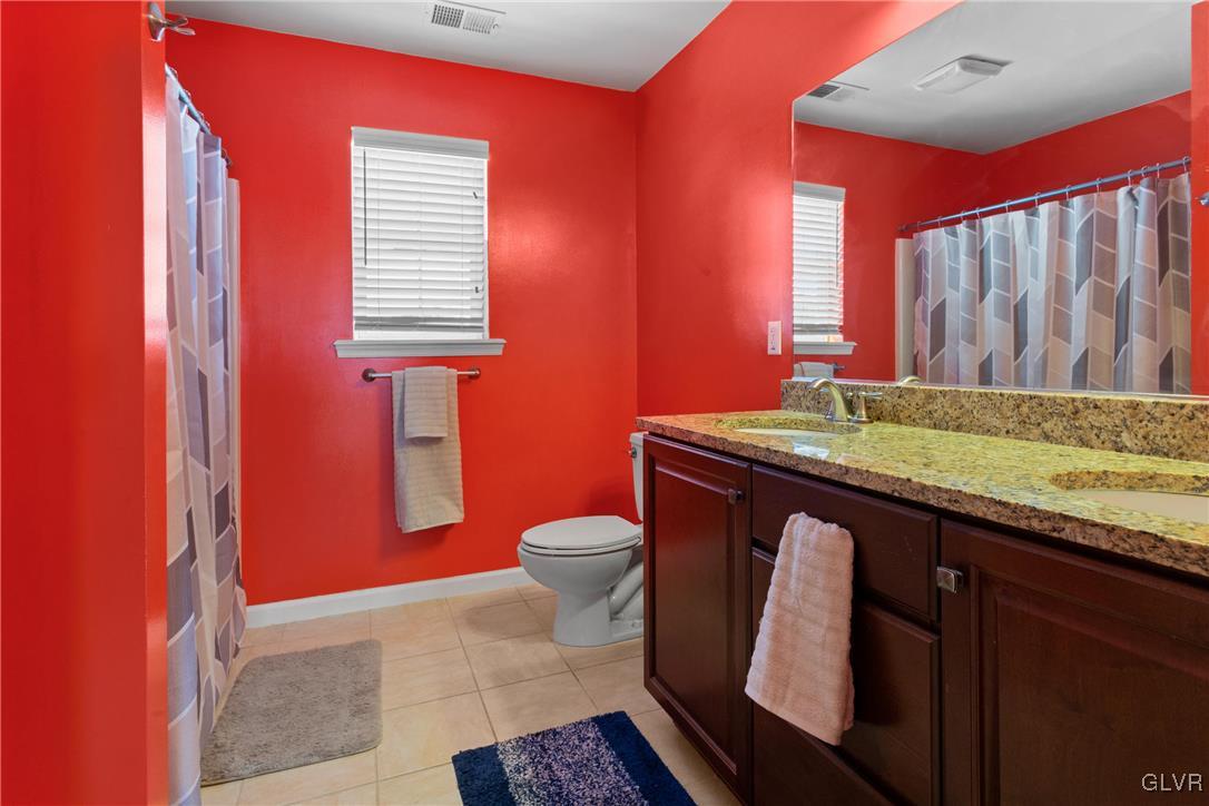 127 Fox Ridge Nazareth, PA 18064 - Photo 28 of 48 a bathroom with a granite countertop toilet sink and mirror