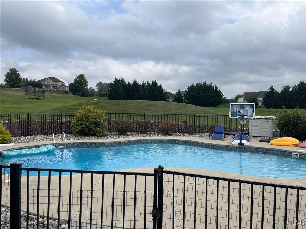 127 Fox Ridge Nazareth, PA 18064 - Photo 38 of 48 a view of a swimming pool and lounge chairs on th terrace
