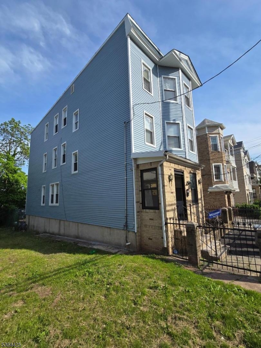 782 Bergen Street, Unit 3 Newark, NJ 07108 - Photo 1 of 20 front view of a house with a yard