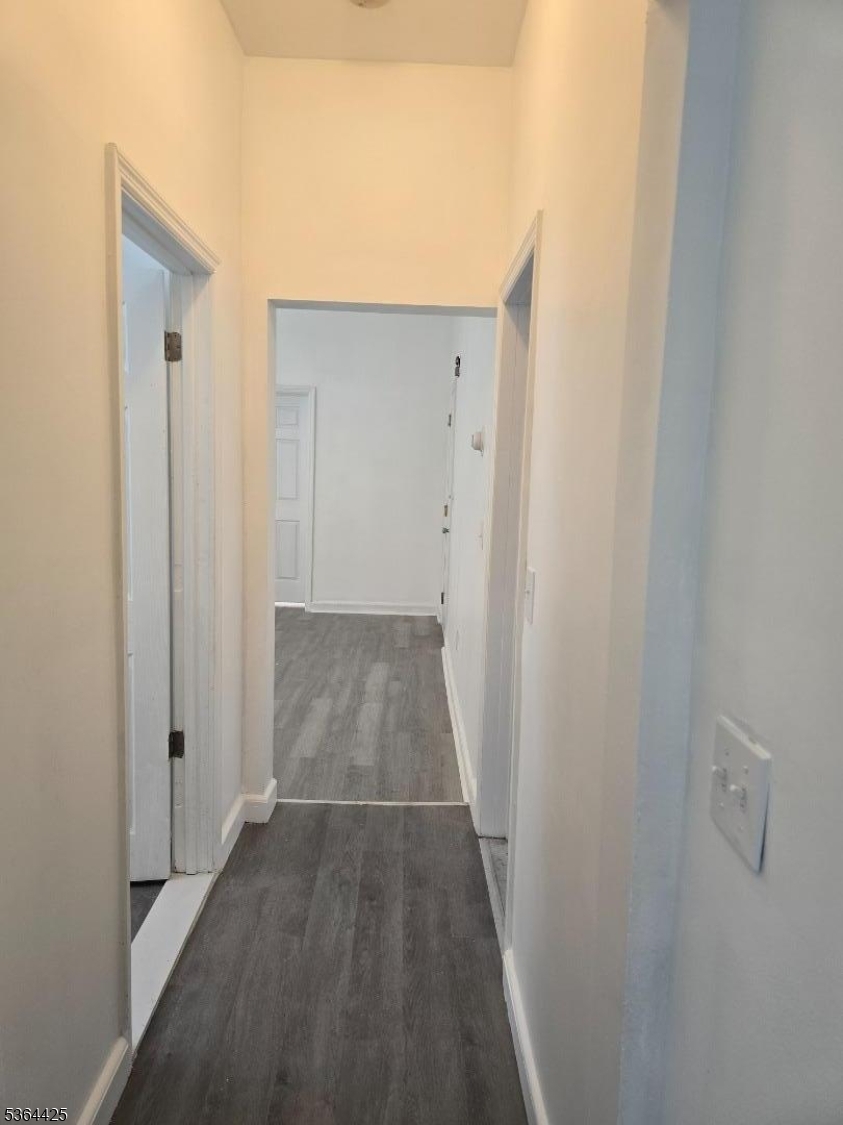782 Bergen Street, Unit 3 Newark, NJ 07108 - Photo 17 of 20 a view of a hallway with wooden floor