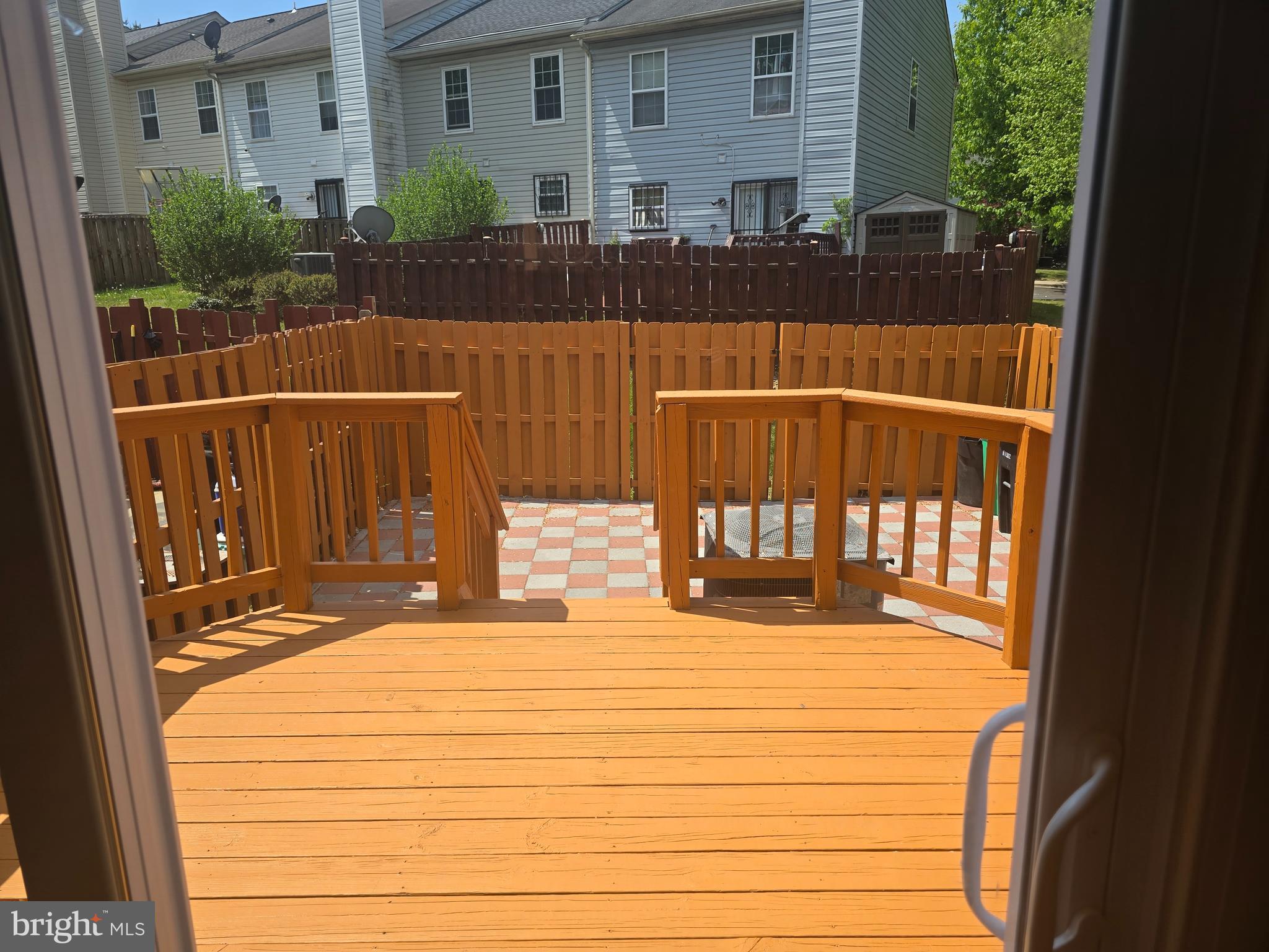 8839 Ritchboro Road District Heights, MD 20747 - Photo 12 of 12 a view of a balcony with two couches and wooden floor