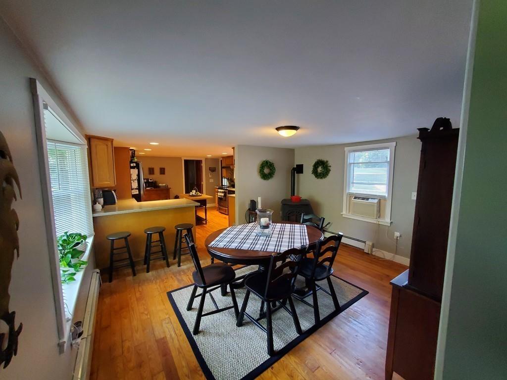 422 Reed Road Dartmouth, MA 02747 - Photo 5 of 25 a view of a dining room with furniture and wooden floor
