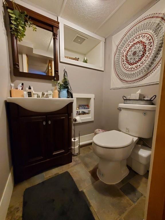 422 Reed Road Dartmouth, MA 02747 - Photo 10 of 25 a bathroom with a toilet sink and mirror