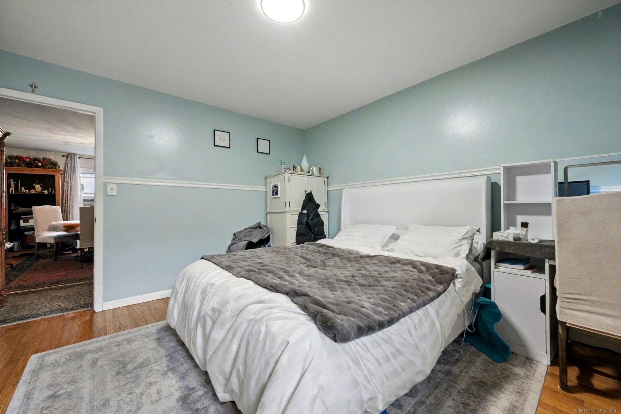 720 Queen Street Bridgeport, CT 06606 - Photo 12 of 36 a bedroom with a bed and a view of kitchen