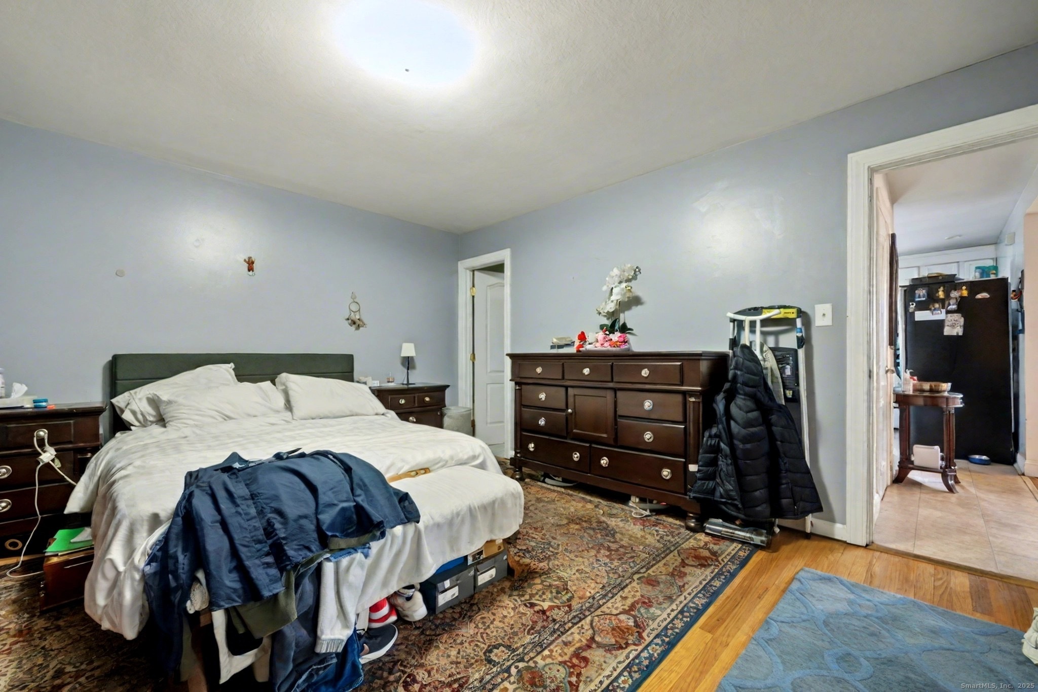 720 Queen Street Bridgeport, CT 06606 - Photo 16 of 36 a bedroom with a bed and a mirror