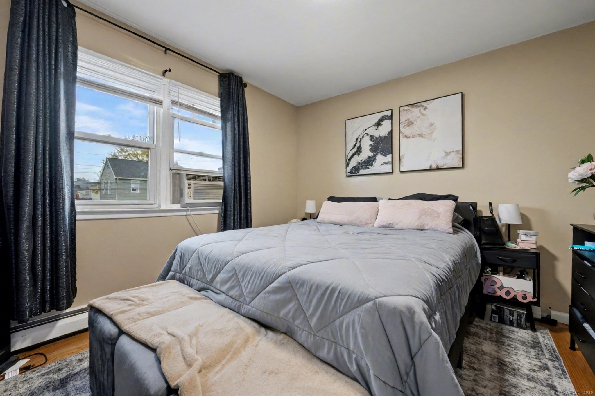 720 Queen Street Bridgeport, CT 06606 - Photo 17 of 36 a bedroom with a bed and a window