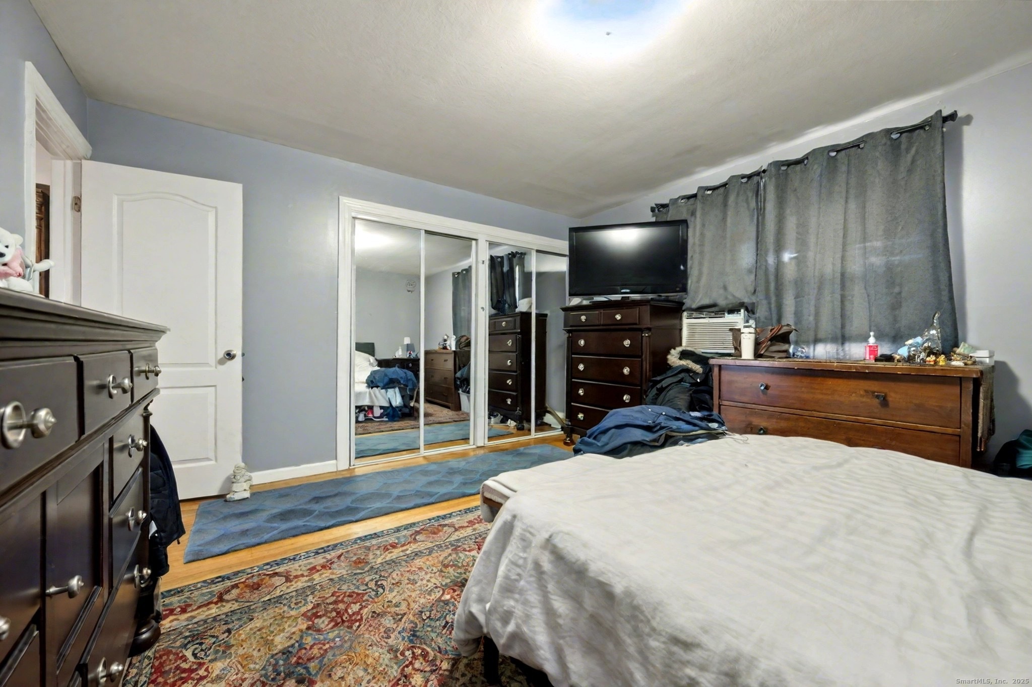 720 Queen Street Bridgeport, CT 06606 - Photo 21 of 36 a bed room with a bed and a television