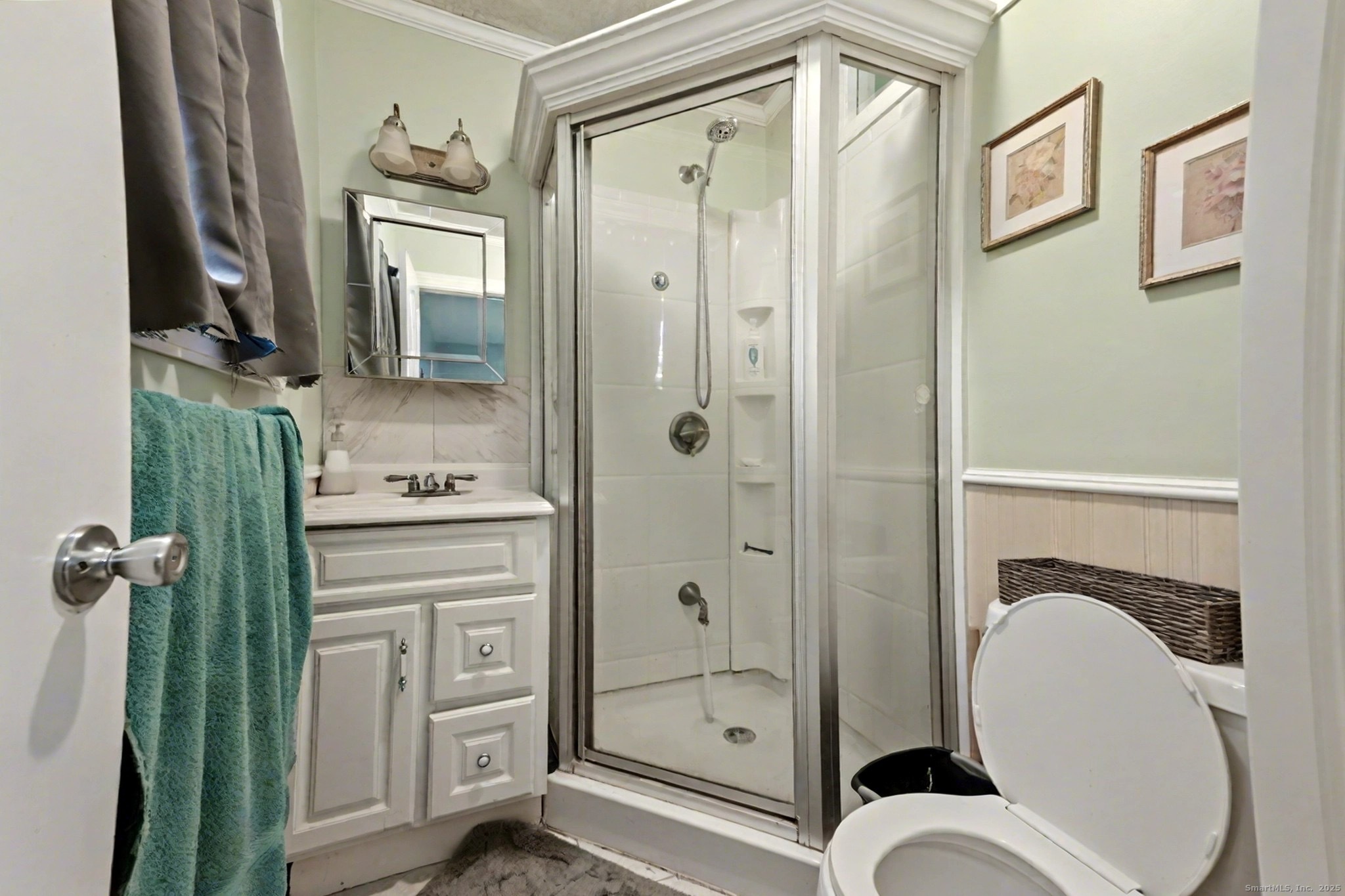 720 Queen Street Bridgeport, CT 06606 - Photo 22 of 36 a bathroom with a shower a mirror and a sink