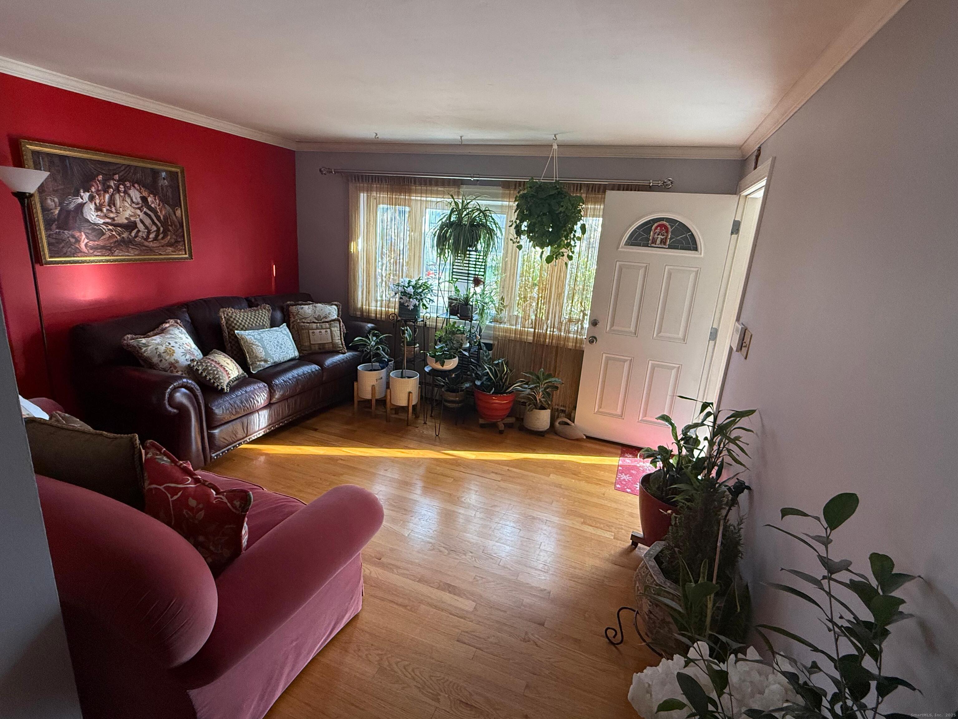 720 Queen Street Bridgeport, CT 06606 - Photo 27 of 36 a living room with furniture and a large window