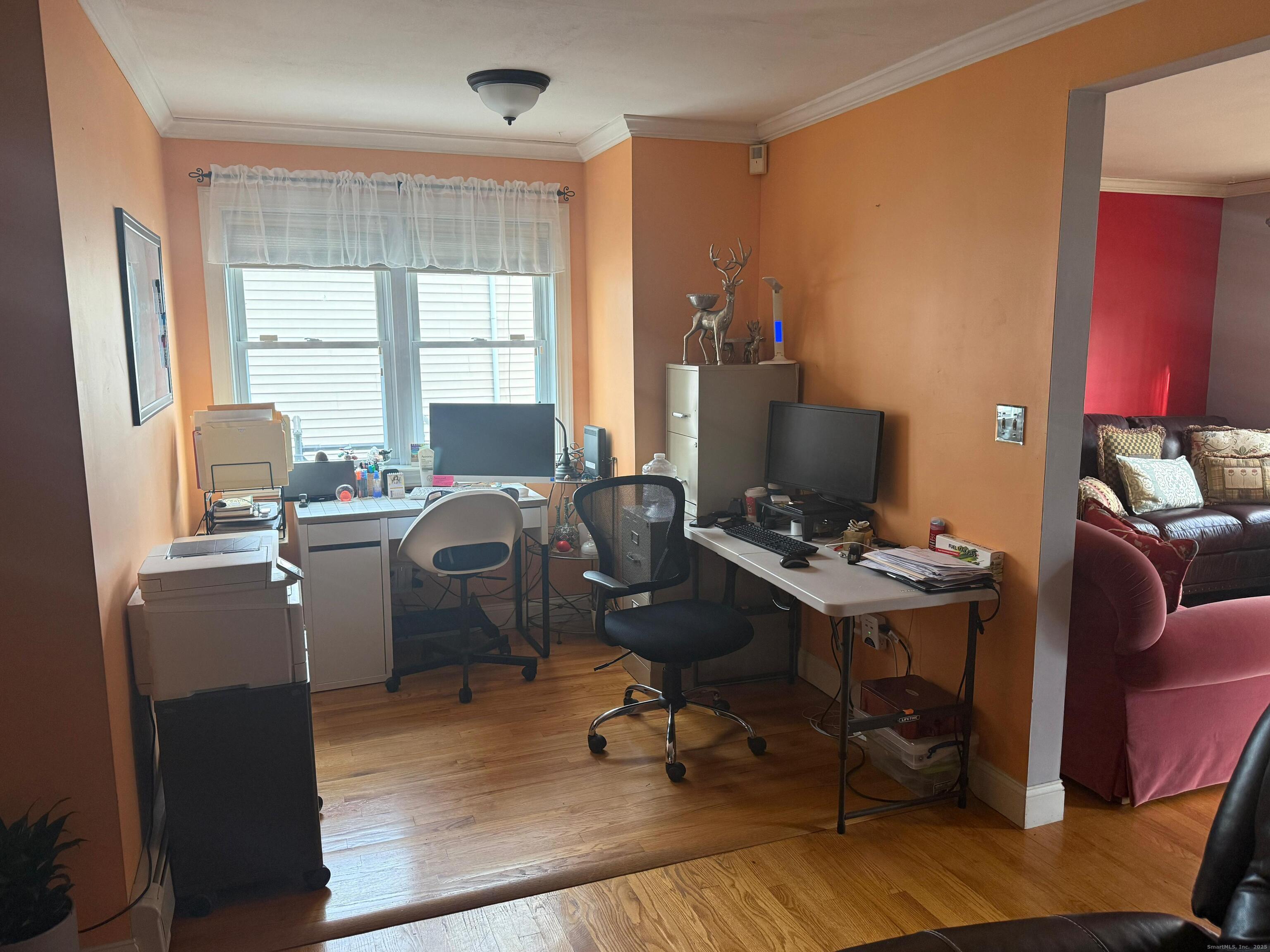 720 Queen Street Bridgeport, CT 06606 - Photo 29 of 36 a view of a workspace with furniture and a window