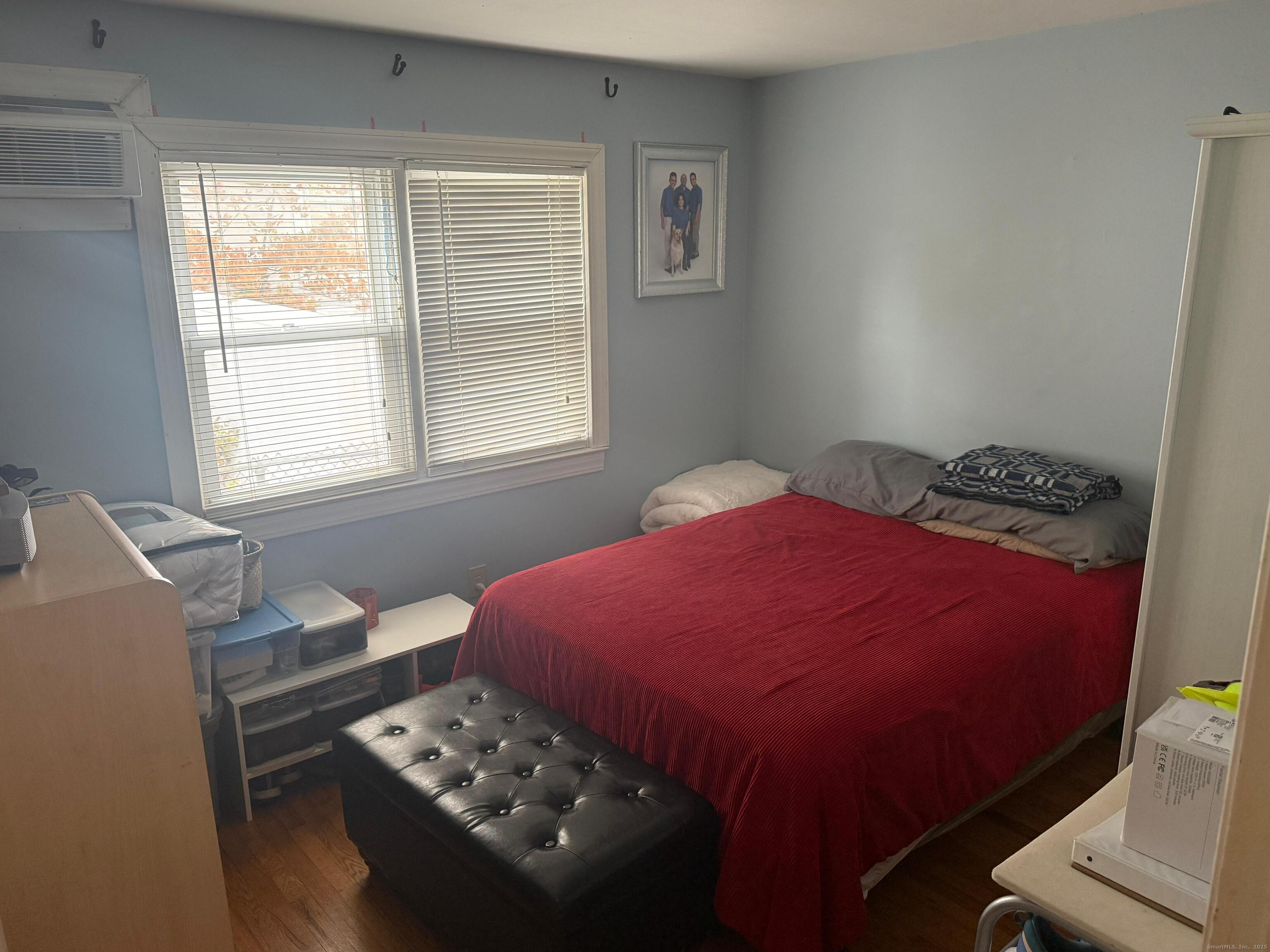 720 Queen Street Bridgeport, CT 06606 - Photo 34 of 36 a bedroom with a bed and a window