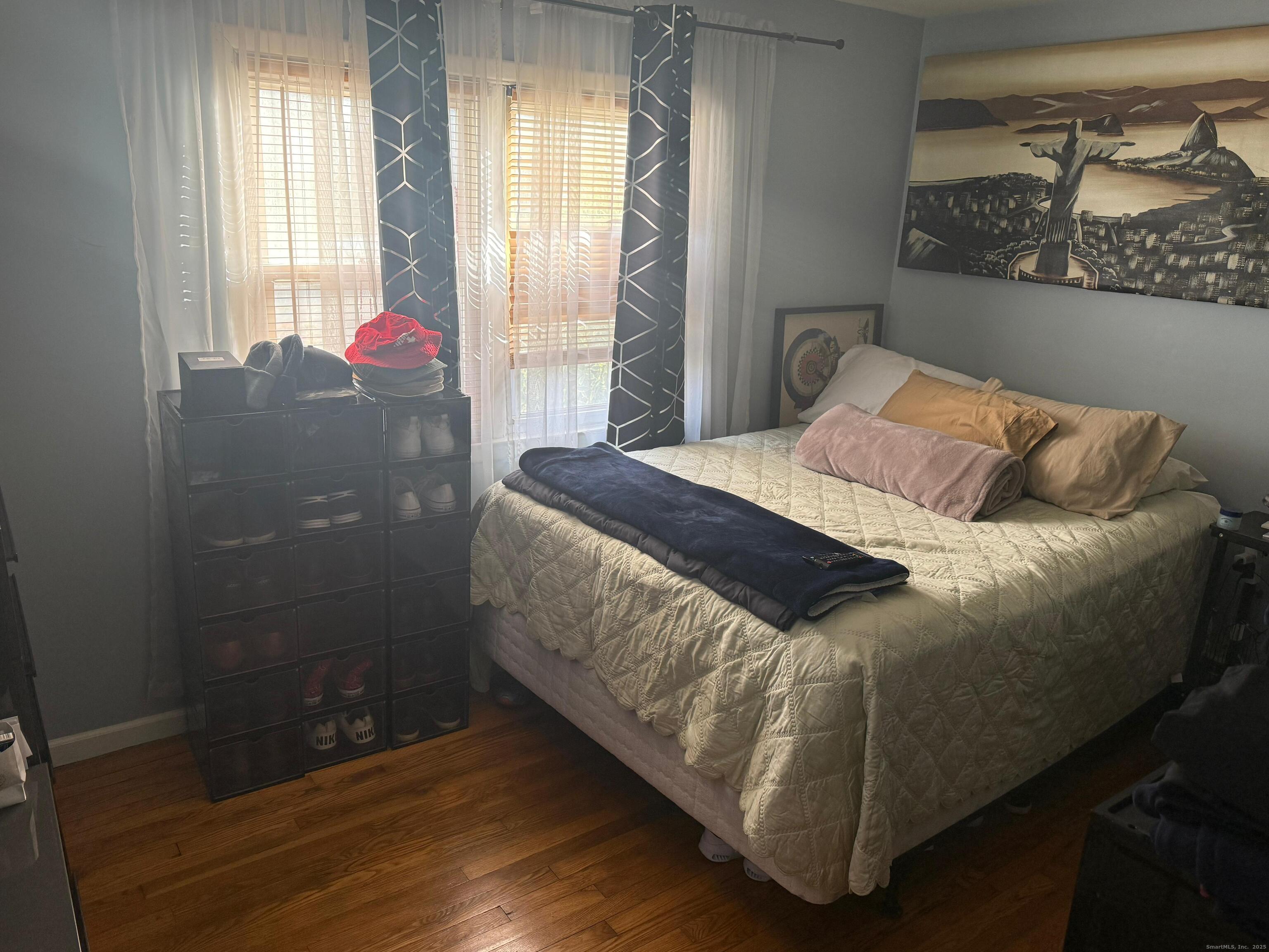 720 Queen Street Bridgeport, CT 06606 - Photo 35 of 36 a bedroom with a bed and window