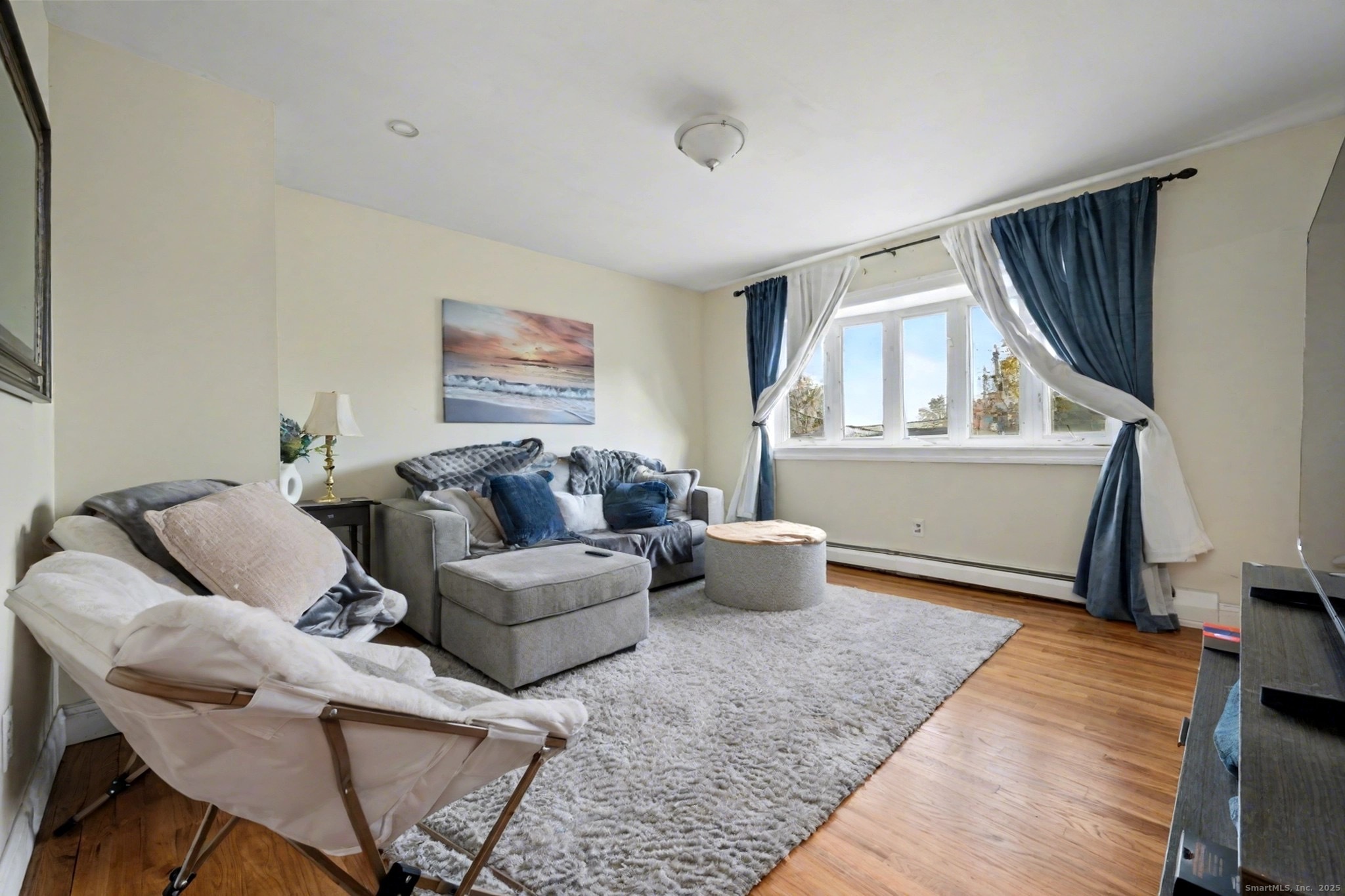 720 Queen Street Bridgeport, CT 06606 - Photo 7 of 36 a living room with furniture and a window