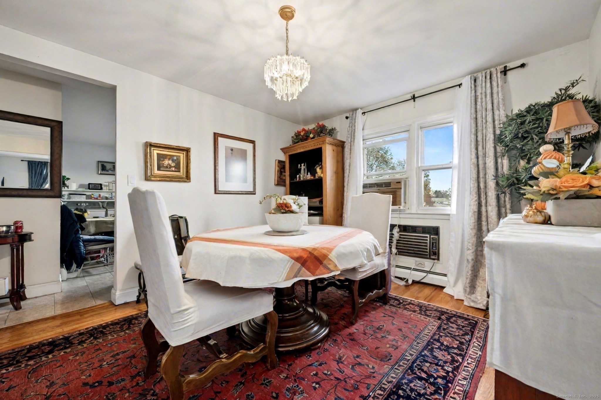 720 Queen Street Bridgeport, CT 06606 - Photo 10 of 36 a bed room with furniture and a chandelier