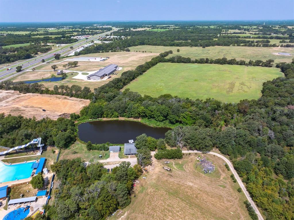 20 Interstate 20 Canton, TX 75103 - Photo 10 of 11 an aerial view of residential houses with outdoor space and swimming pool