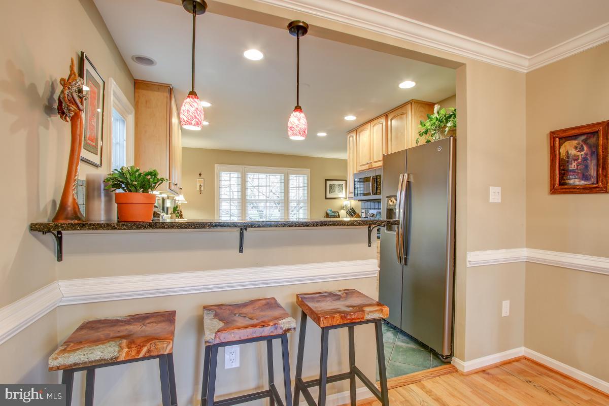 2014 Homer Terrace Reston, VA 20191 - Photo 14 of 44 Bar seating in kitchen, adjacent to Dining Room