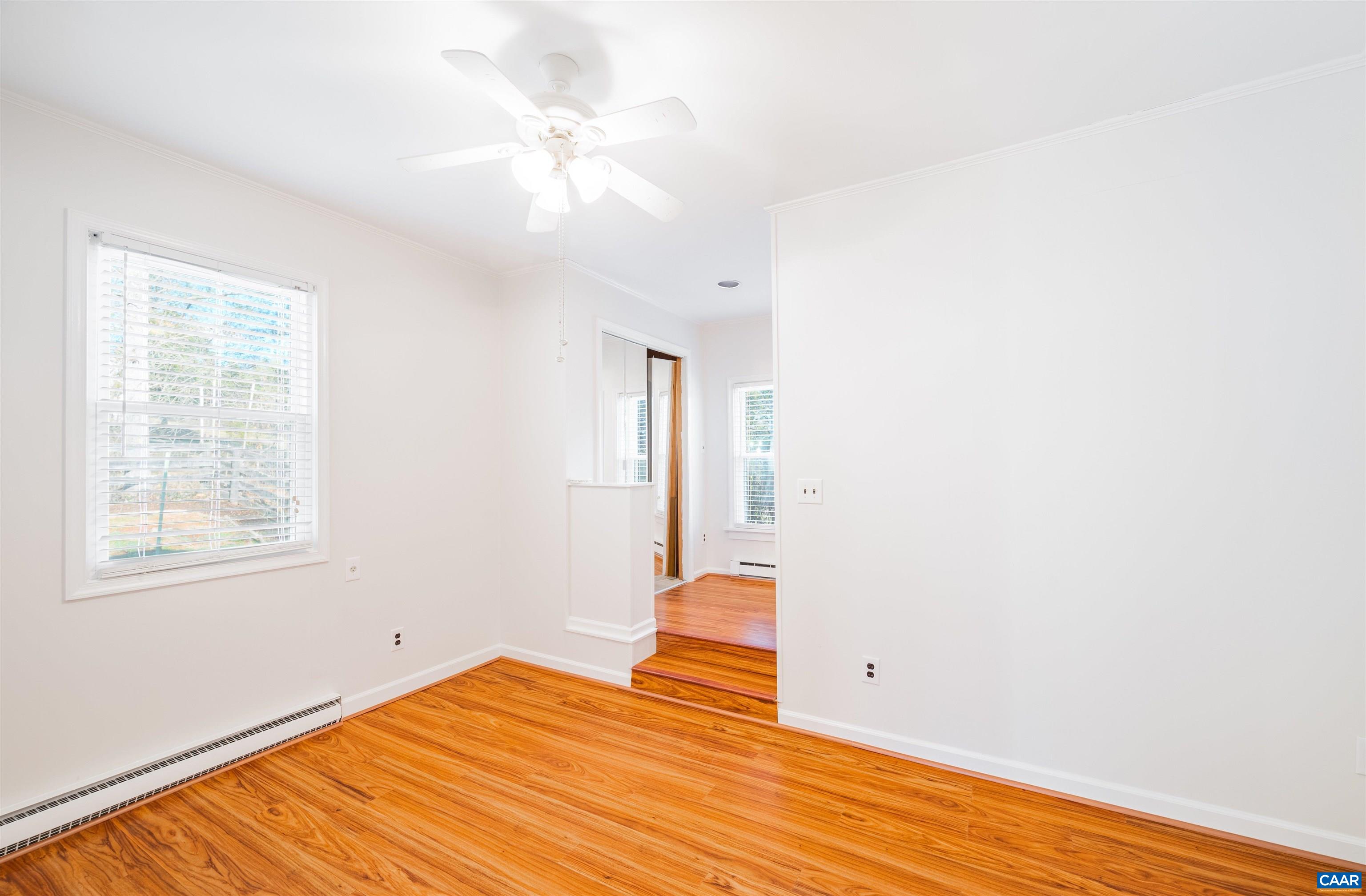 5688 Advance Mills Road Ruckersville, VA 22968 - Photo 21 of 52 a view of a room with wooden floor and fan