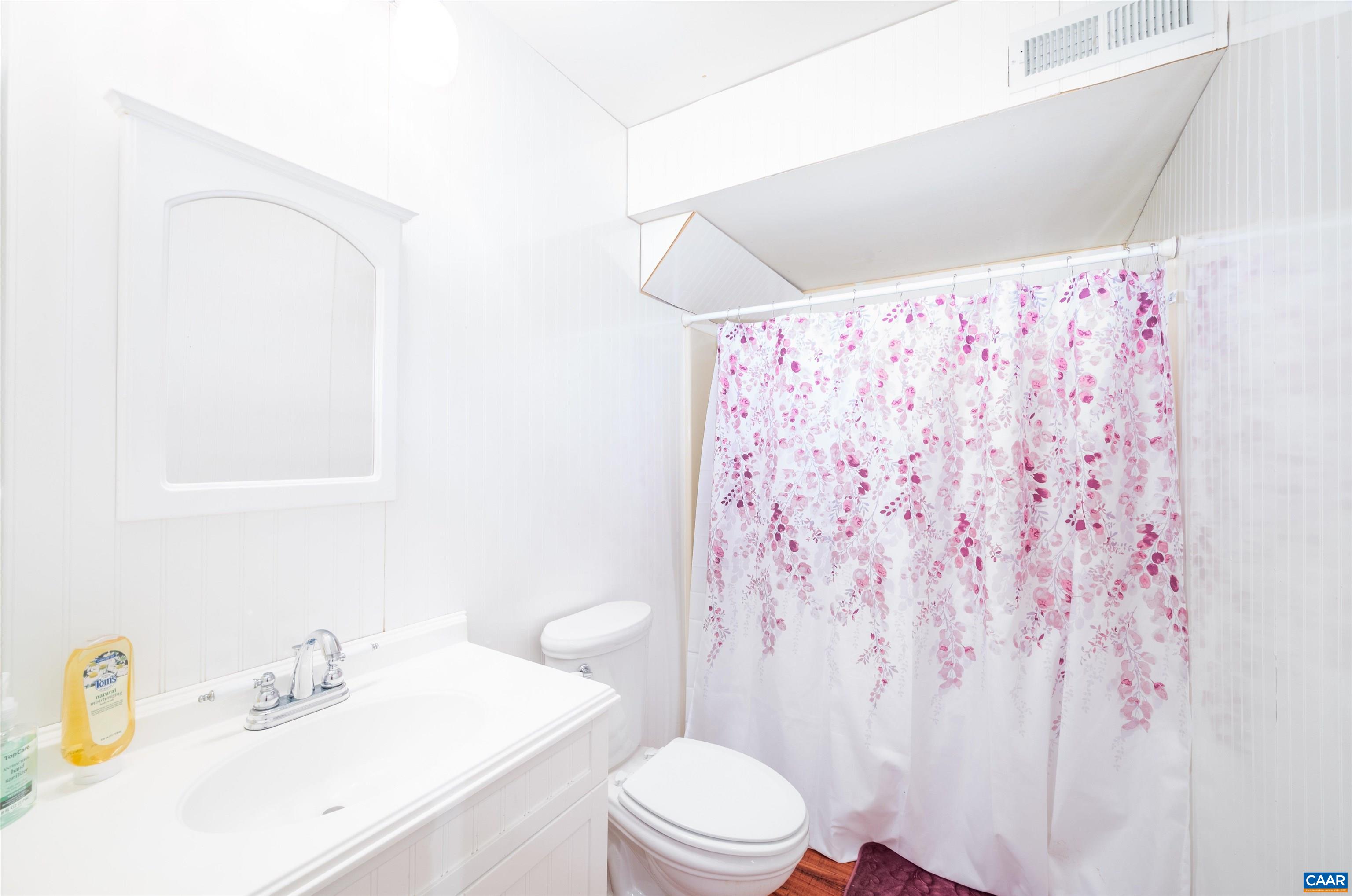 5688 Advance Mills Road Ruckersville, VA 22968 - Photo 34 of 52 a bathroom with a sink toilet and shower