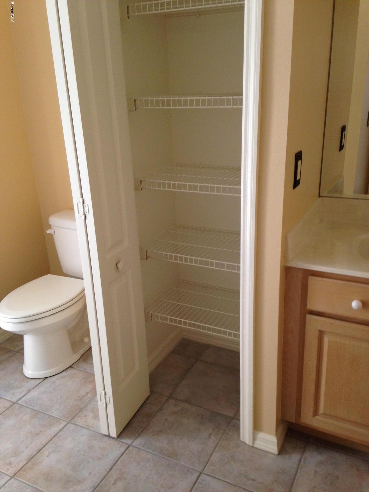 1207 Winding Meadows Road Rockledge, FL 32955 - Photo 18 of 27 Second Bathroom has Pool Door