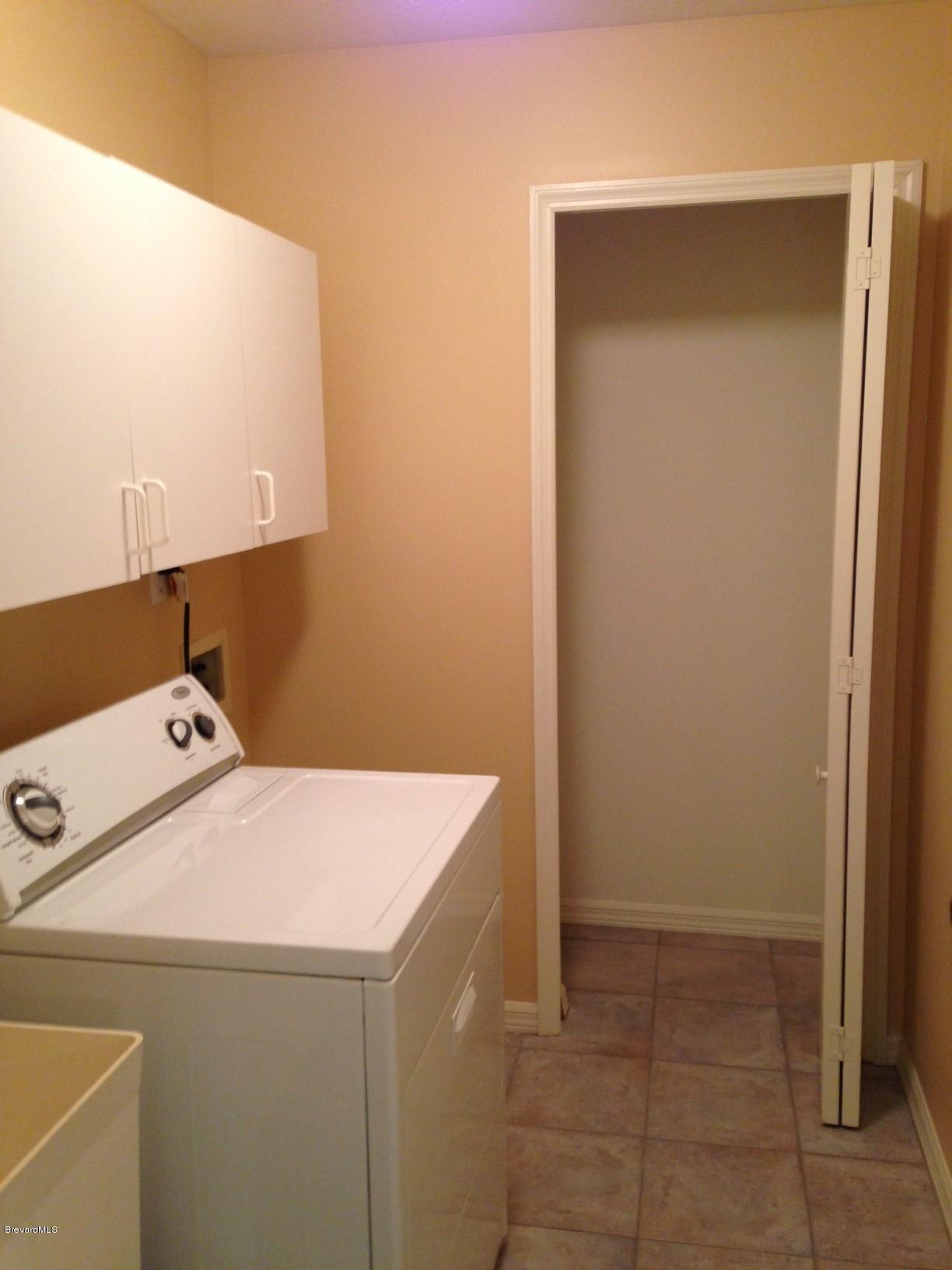 1207 Winding Meadows Road Rockledge, FL 32955 - Photo 19 of 27 Laundry has Sink, Cabinets, and Closet