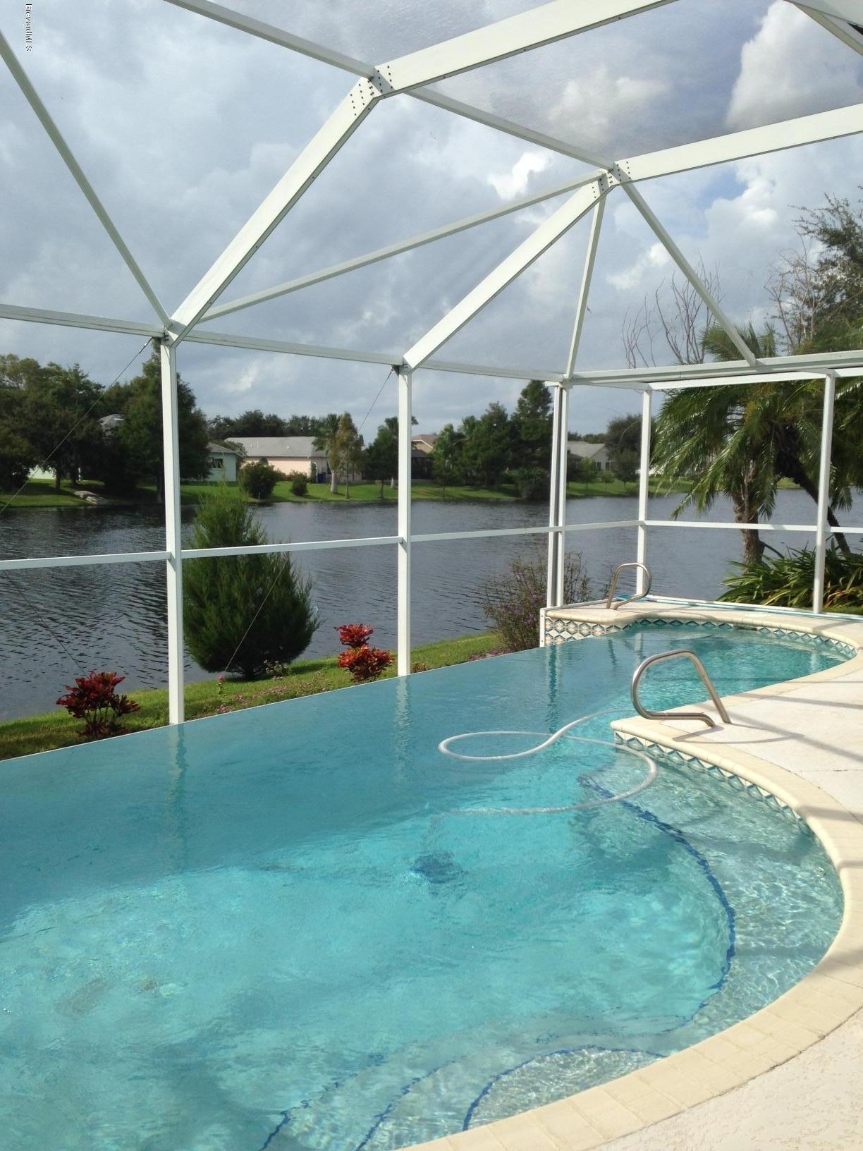 1207 Winding Meadows Road Rockledge, FL 32955 - Photo 23 of 27 Pool has a Vanishing Edge