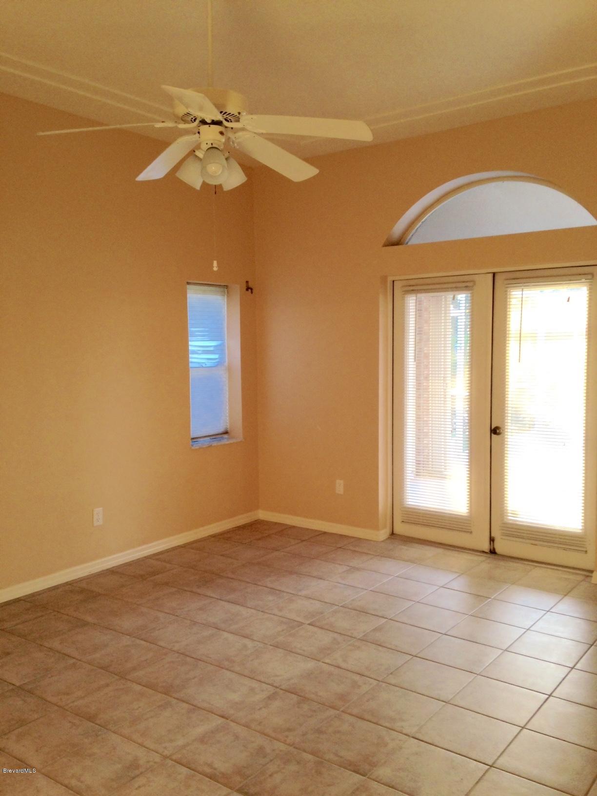 1207 Winding Meadows Road Rockledge, FL 32955 - Photo 9 of 27 Master Bedroom with French Doors to Pool