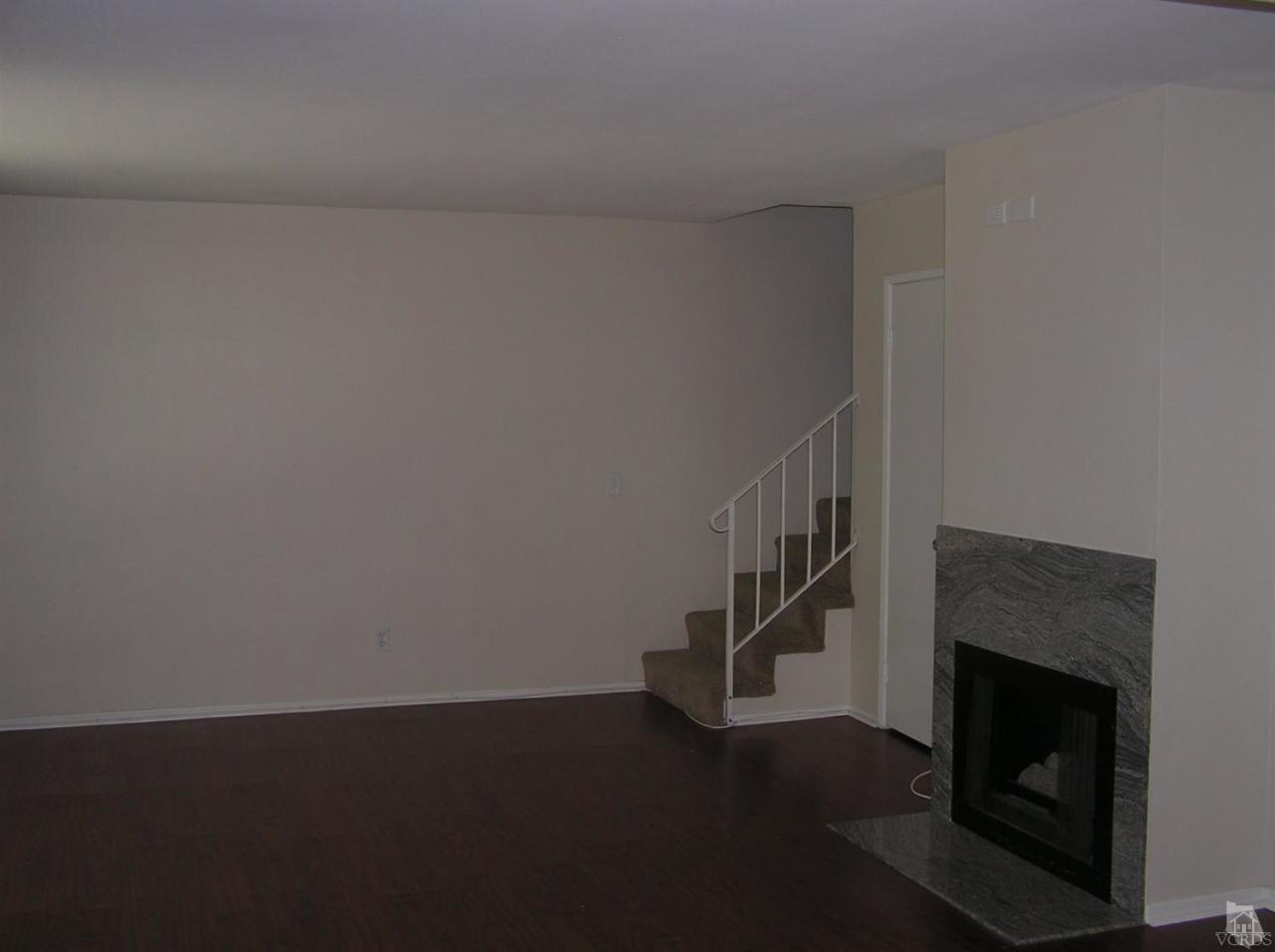 516 Spring Road, Unit 114 Moorpark, CA 93021 - Photo 2 of 13 a view of entryway with wooden floor