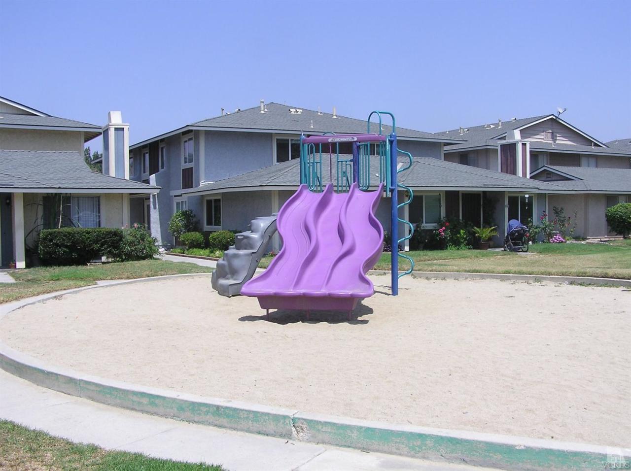 516 Spring Road, Unit 114 Moorpark, CA 93021 - Photo 13 of 13 a view of multiple houses with a street