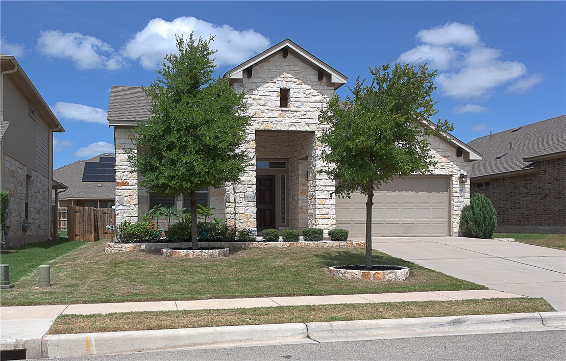 front view of a house with a yard