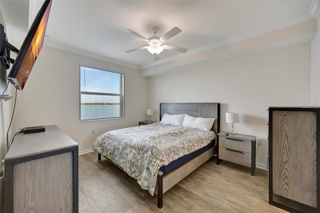 910 Tidewater Shores Loop, Unit 304 Bradenton, FL 34208 - Photo 13 of 42 a bedroom with a bed and a window