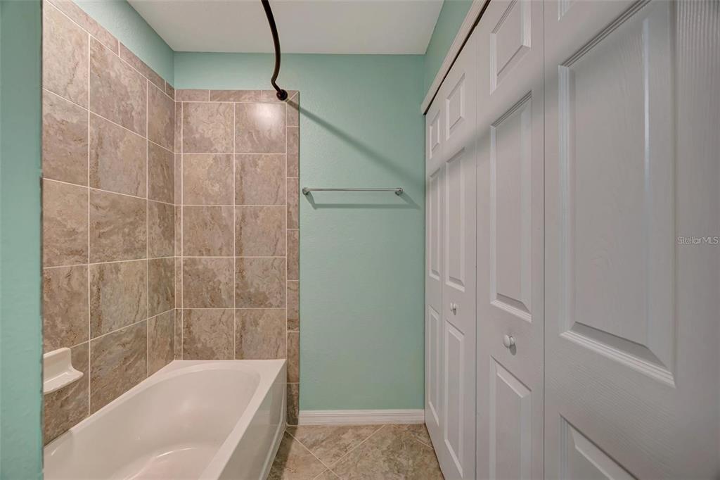 910 Tidewater Shores Loop, Unit 304 Bradenton, FL 34208 - Photo 21 of 42 a bathroom with a shower and a bathtub