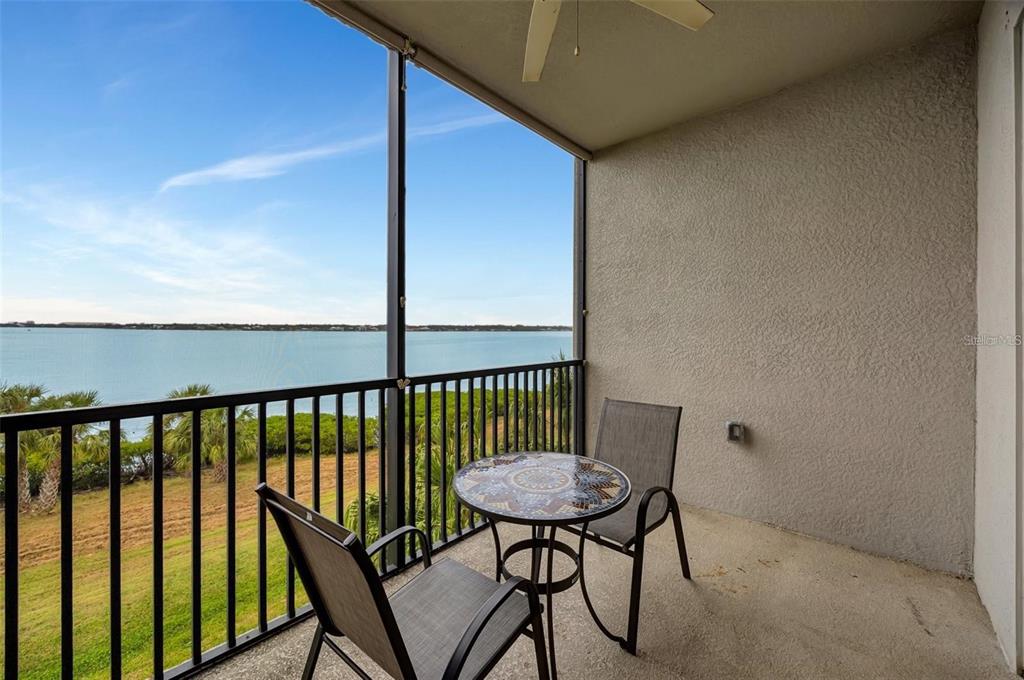 910 Tidewater Shores Loop, Unit 304 Bradenton, FL 34208 - Photo 23 of 42 a view of a balcony with chairs