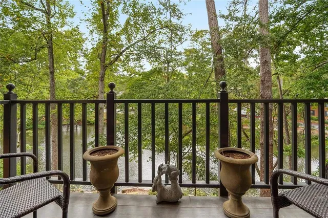 a view of balcony with couch and chairs
