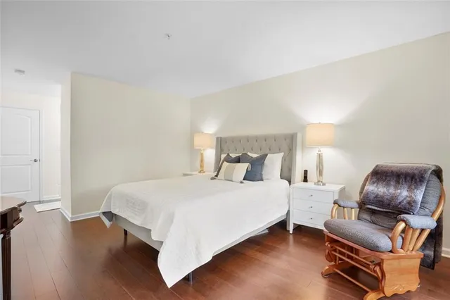 a bedroom with a bed and a couch