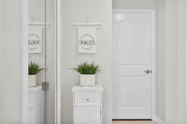 a potted plant sitting next to a white cabinet