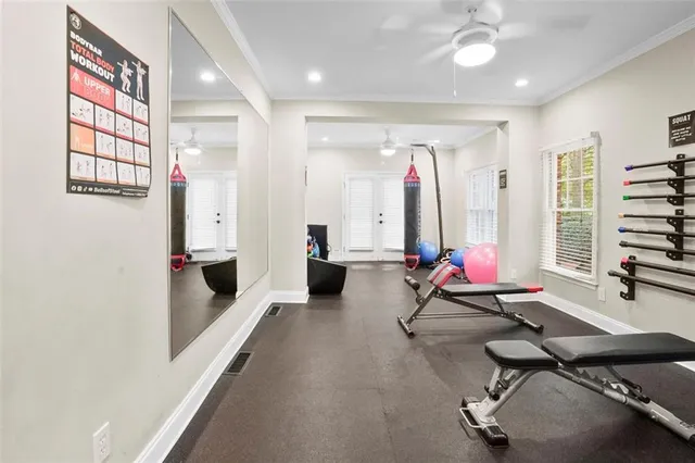 a room with furniture and gym equipment