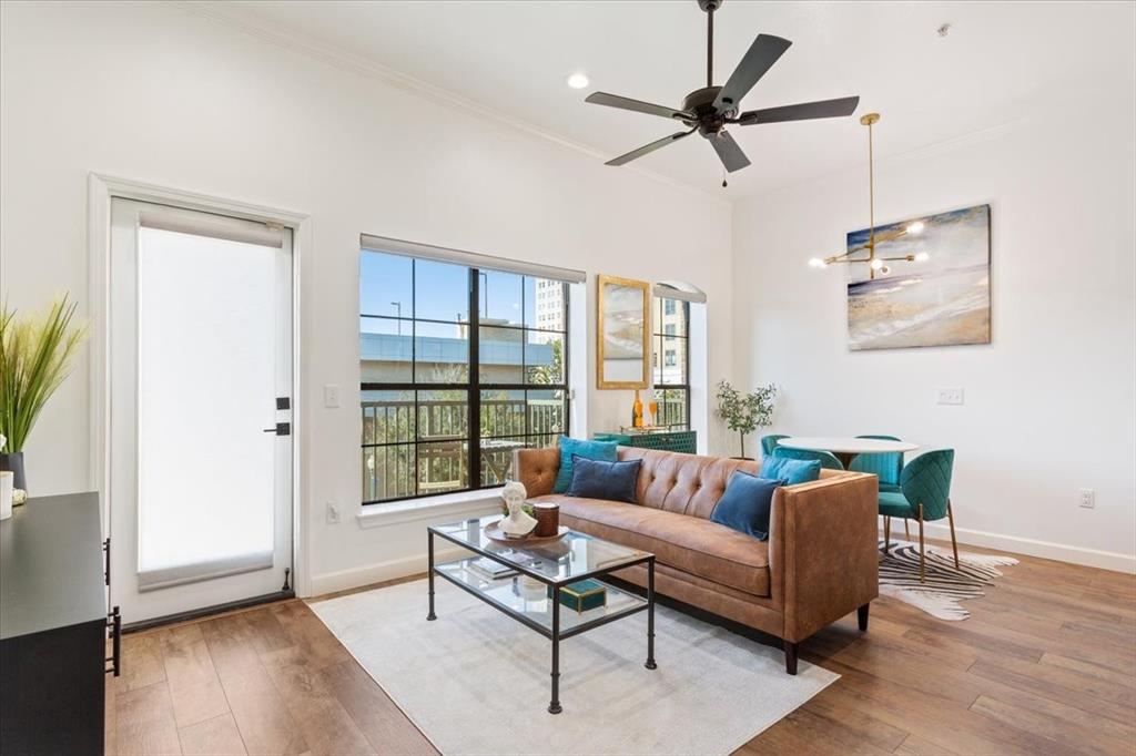330 Austin Avenue, Unit 318 Waco, TX 76701 - Photo 11 of 22 Living room featuring crown molding, wood finished floors, a ceiling fan, and recessed lighting