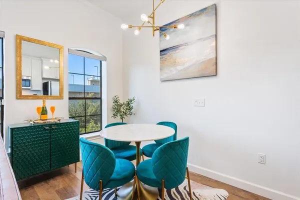 a view of a dining room with furniture and window