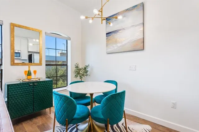 a view of a dining room with furniture and window