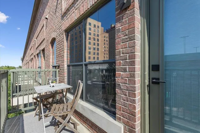 a view of a balcony with chairs