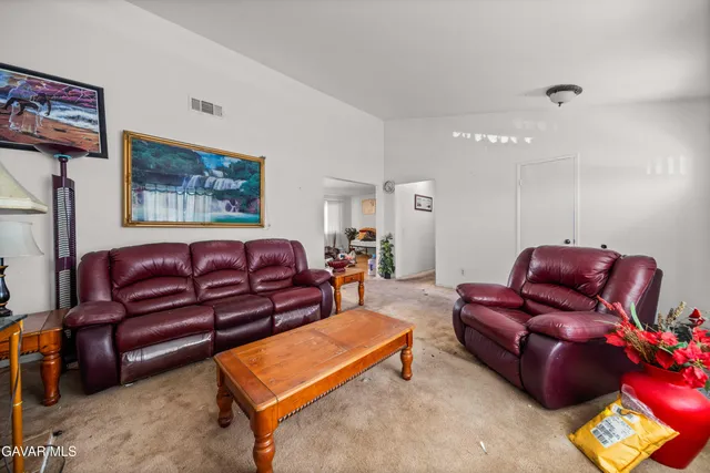 a living room with furniture and a couch