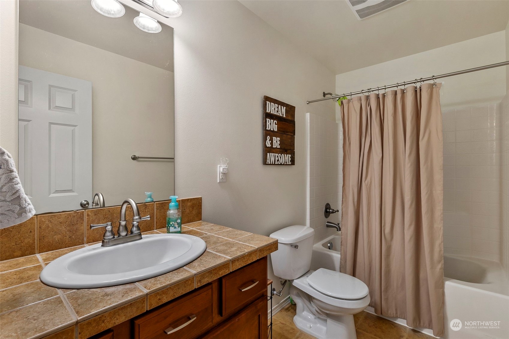 1328 Foreman Road DuPont, WA 98327 - Photo 20 of 37 a bathroom with a granite countertop sink toilet and a mirror
