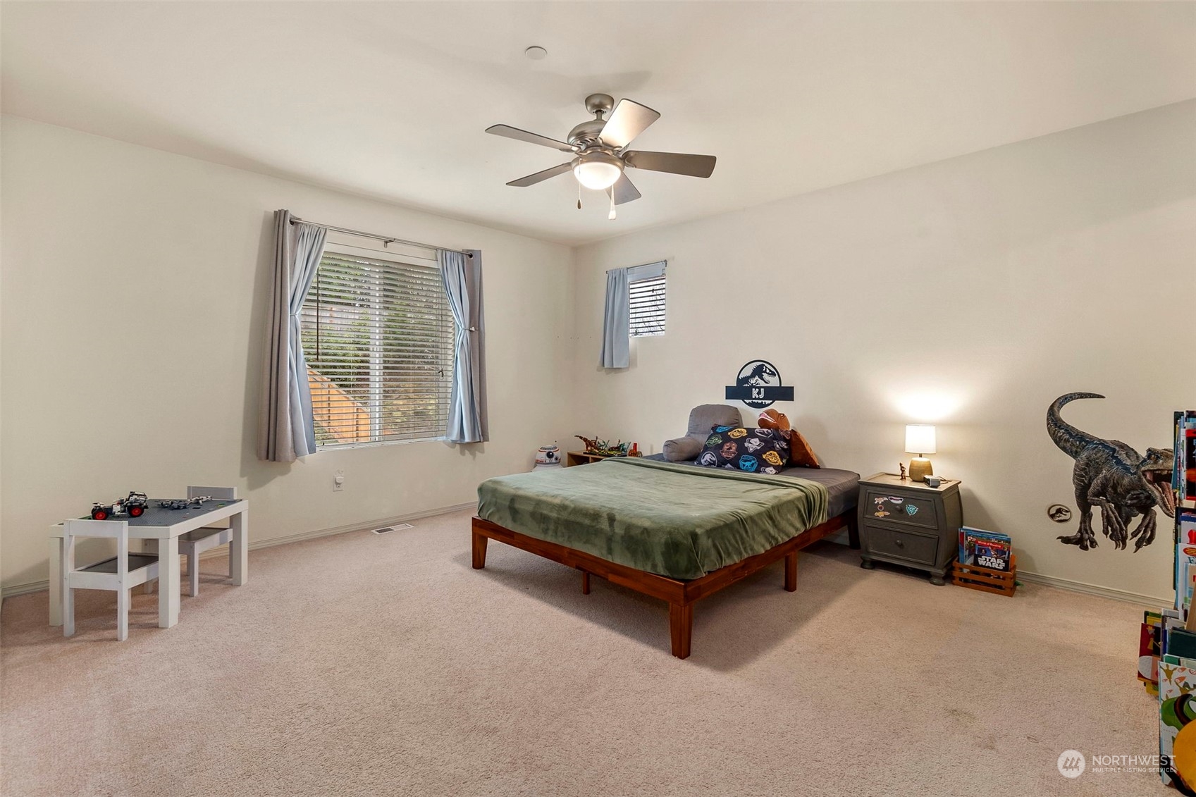 1328 Foreman Road DuPont, WA 98327 - Photo 21 of 37 a bedroom with a bed and a chandelier
