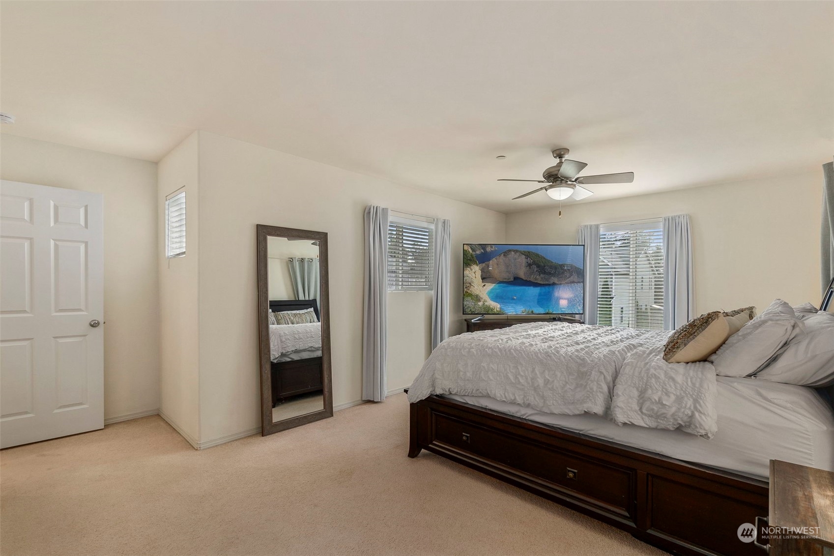 1328 Foreman Road DuPont, WA 98327 - Photo 25 of 37 a bedroom with a bed and a chandelier