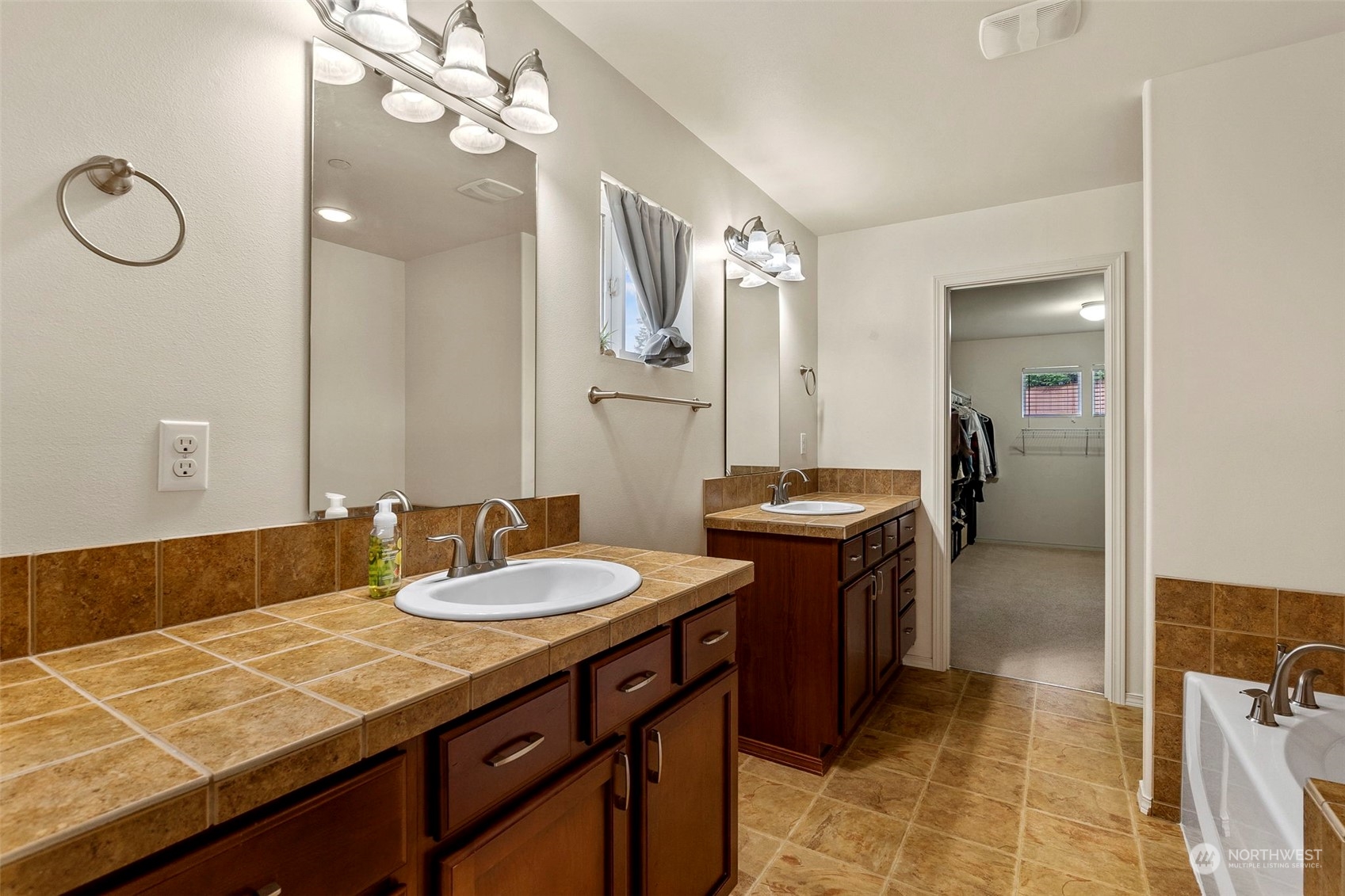 1328 Foreman Road DuPont, WA 98327 - Photo 29 of 37 a bathroom with a granite countertop sink and a mirror